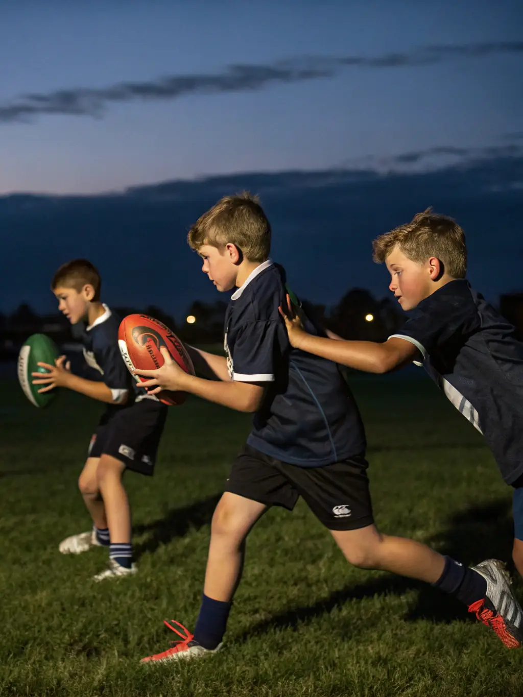 A group of young players learning rugby skills during a youth training session at C.S. Clichy Rugby Folklo.